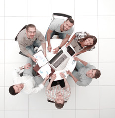 top view.business team sitting round table