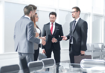 employees talking standing in the office