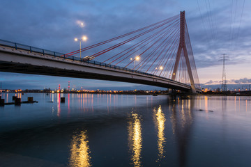 Fototapeta na wymiar Cable stayed bridge over Martwa Wisla river at dusk in Gdansk. Poland Europe