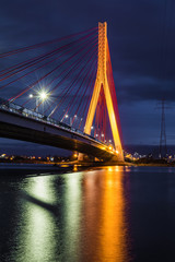 Fototapeta na wymiar Illuminated cable stayed bridge over Martwa Wisla river at night in Gdansk. Poland Europe