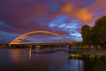 Railway bridge over Martwa Wisla river at night in Gdansk. Poland Europe.