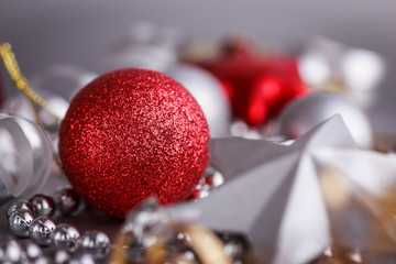 Christmas composition of Christmas tree toys on a blurred silver background