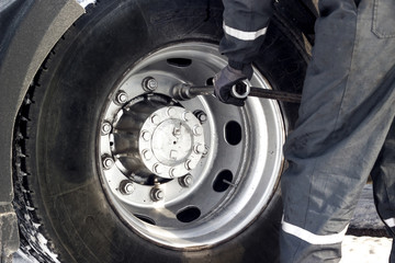 Big wrench and truck tyre.