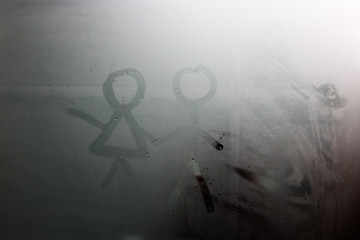 The drawing on the sweaty glass - couple a man and woman