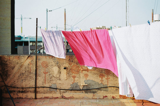 Sheets drying on rooftop
