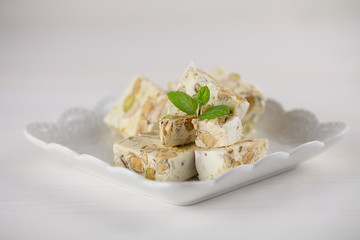 Italian torrone or nougat with almonds and pistachios from Apulia, traditional christmas sweets