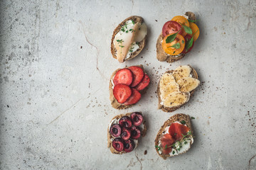 Healthy breakfast. Flat-lay of vegan toasts. Clean eating food concept. Top view. Copy space