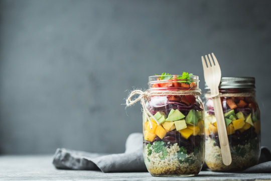 Healthy homemade salad in mason jar with quinoa and vegetables. Healthy food, clean eating, diet and detox. Copy space