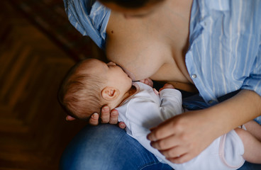 the mother feeds her baby