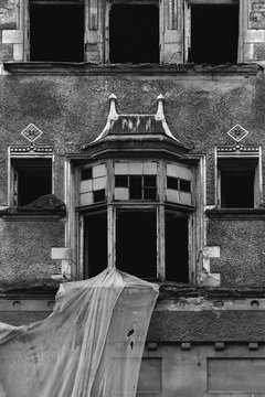 Smashed window of old building