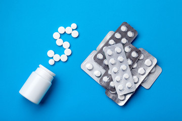 Background on a medical theme with a bunch of medical products with a plastic white bottle and a...