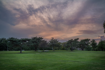 Dramatic sunset skies over a park
