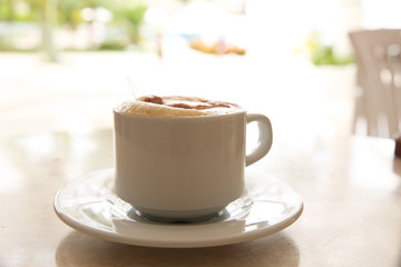 cup of cappuccino on the table