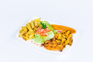 South American cuisine: French fries with salad, fried banana and grilled meat