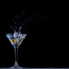 Dry Martini with splashing olive