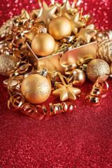 Christmas composition of Christmas tree toys on a blurred red background