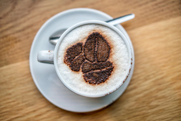 Delicious Cappuccino Coffee, on wooden table