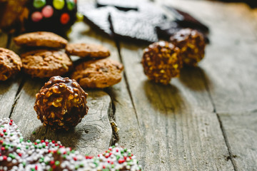 Chocolate chips and cookies with delicious topping, brown tones.