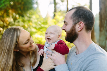 Young Family Holding Baby