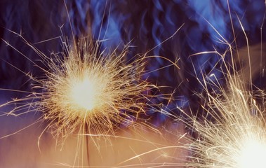 Fototapeta premium new year sparkler, glitter on gold