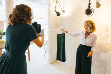 Mature blogger showing an outfit. Personal shopper working at office. 