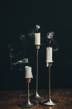 Snuffed Candles in Brass Candlesticks