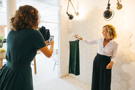 Mature blogger showing an outfit. Personal shopper working at office. 