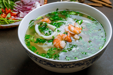 Vietnamese soup Pho with shrimp and squid