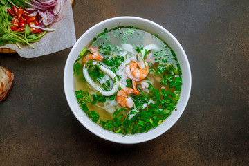 Vietnamese soup Pho with shrimp and squid
