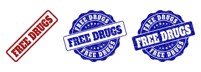 FREE DRUGS grunge stamp seals in red and blue colors. Vector FREE DRUGS watermarks with scratced effect. Graphic elements are rounded rectangles, rosettes, circles and text titles.