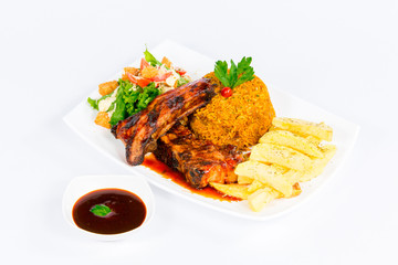 South American cuisine: rice with french fries, meat grill, salsa  and vegetable salad