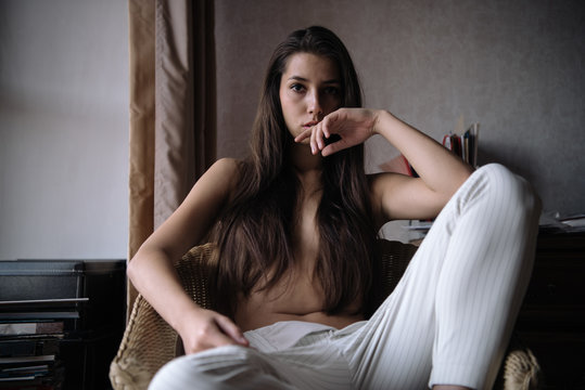 Provocative model posing topless