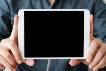 Man hands using tablet with blank screen for mock up template background, business technology and lifestyle background concept