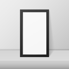 Vector 3d Realistic Modern Interior Black Blank Vertical Wooden Poster Picture Frame on Table, Shelf Closeup on White Wall, Mock-up. Empty Poster Frame Design Template for Mockup, Presentation