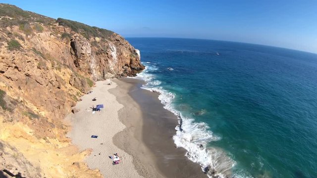 Californian aerial view of Pirates Cove beach, a small cove on west side of Point Dume, Malibu coast, United States. Blue sky, summer season, sunny day. Pacific coast in CA. Copy space.