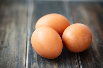 Chicken eggs on wooden table