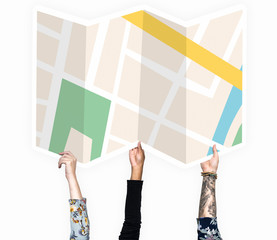 Hands holding a map cardboard prop