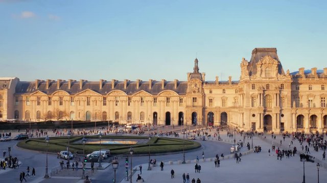 famous paris museum louvre pyramids square, france in sunset