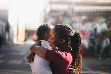 Couple hugging in the city
