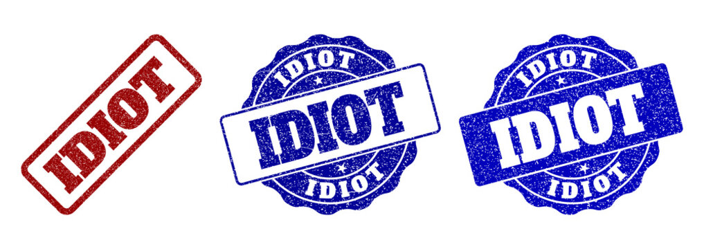 IDIOT grunge stamp seals in red and blue colors. Vector IDIOT imprints with grainy texture. Graphic elements are rounded rectangles, rosettes, circles and text titles.