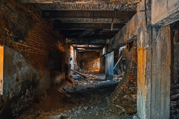Fototapeta na wymiar Dark tunnel or corridor im abandoned industrial building inside