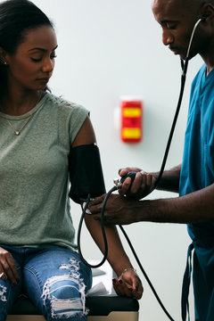 Exam: Woman Has Blood Pressure Tested