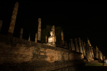 Ancient ruined Wat Mahathat in Sukhothai Historical Park at night, Sukhothai province, Thailand