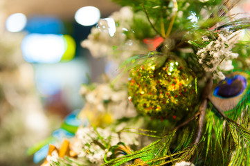 Christmas ball on the tree in the background with other decorations and garlands. copy space.