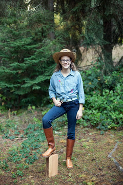Preteen Girl Poses In Her Costume For Cowboy Day Of Spirit Week At Her Middle School.