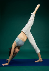 Pretty woman doing yoga exercise