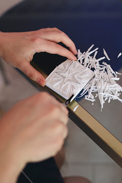 Close up of anonymous hands making homemade rubber stamps