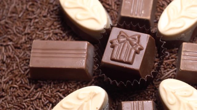 Chocolate candies, sweets in rotation. Closeup.