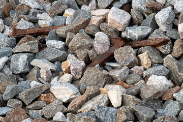 Macro rusty railroad spikes and granite gravel 4