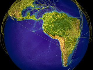Latin America from space on Earth with country borders and lines representing international communication, travel, connections.